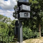 High-wattage projectors aimed at the white castle wall