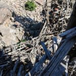 Suspended on nothing but nailed-together driftwood above very hard rocks should one fall.